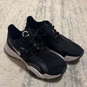 Black and White Nike Train Sneakers